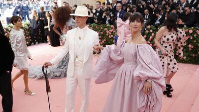 Looking like a modern day Oscar Wilde, Benedict Cumberbatch strode the red carpet in head to toe white, and carrying a cane. His wife, Sophie Hunter wore palest lilac. EPA