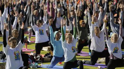 Hundreds of participants practice a group yoga class as part of the annual World Yoga Day celebrations at the Wanderers Stadium, Johannesburg, South Africa. Kim Ludbrook / EPA
