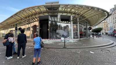 Smashed windows at the Nike store in Paris. Reuters