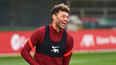 Alex Oxlade-Chamberlain of Liverpool laughs during a training session at AXA Training Centre in Kirkby, England. All photos by Getty Images