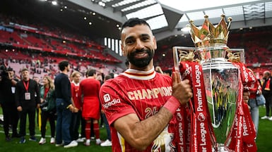 Liverpool's Egyptian striker Mohamed Salah with the Premier League trophy at the end of the 2024/25 season. AFP