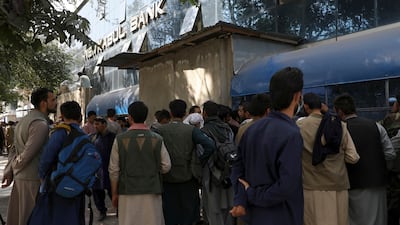 Afghans wait in long lines for hours to try to withdraw money, in front of Kabul Bank, in Kabul, Afghanistan on Sunday. AP