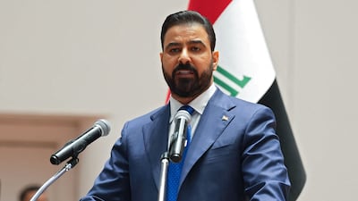 Ali Al Zaidi speaks in the Iraqi Parliament on Thursday before members voted to approve most of his nominees for cabinet posts. AFP