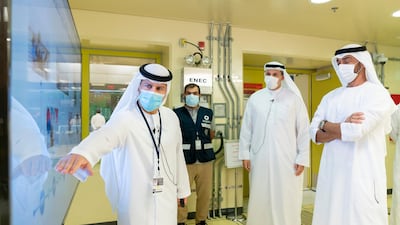 Sheikh Mohamed views a presentation by Mohamed Al Hammadi, chief executive of Emirates Nuclear Energy Corporation. Mohamed Al Hammadi / Ministry of Presidential Affairs