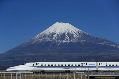 A Shinkansen bullet train runs in front of Mount Fuji in Shizuoka, Japan. Getty Images