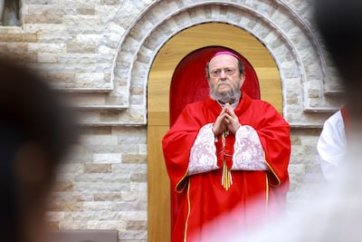 Bishop Paolo Martinelli presides over the Good Friday service at St Therese Church. Victor Besa / The National