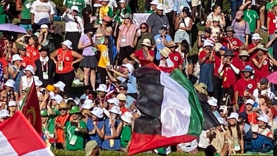 UAE expatriates said they were proud to carry the flag of the Emirates during a procession at the Papal Mass in Lisbon on Sunday. Photo: Apostolic Vicariate of Southern Arabia