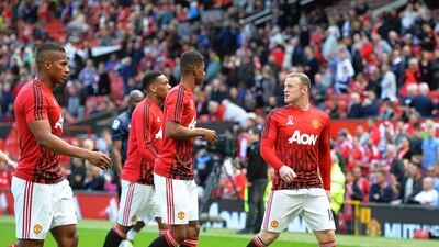 Manchester United's Wayne Rooney, right, and his teammates leave the pitch as fans are evacuated from Old Trafford due to a bomb scare that saw the Premier League game against Bournemouth called off in May, 2016. EPA