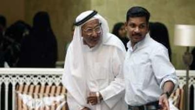 Mohammed Haneef, a carer, helps Abdullah Mubarak, a 65-year old resident, find a seat during the International Day for the Elderly celebrations at the Old People's Home in Sharjah last week.