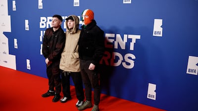 From left, Naoise O Caireallain, Liam Og O hAnnaidh and JJ O Dochartaigh of Kneecap. O hAnnaidh will face a terrorism charge in a London court on June 18. AFP