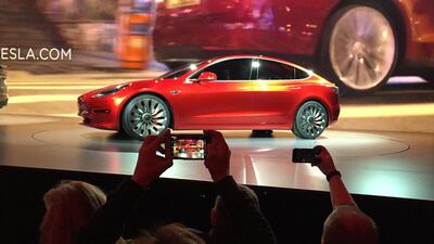 Tesla Motors unveils the new lower-priced Model 3 sedan at the Tesla Motors design studio. Justin Prichard / AP Photo