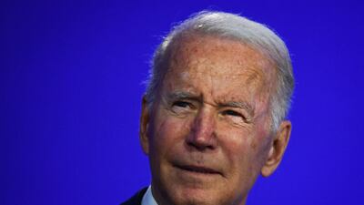 US President Joe Biden reacts as he delivers a speech on stage during a meeting at the COP26 UN Climate Change Conference in Glasgow, Scotland, on November 1, 2021. - COP26, running from October 31 to November 12 in Glasgow will be the biggest climate conference since the 2015 Paris summit and is seen as crucial in setting worldwide emission targets to slow global warming, as well as firming up other key commitments (Photo by Brendan Smialowski / AFP)