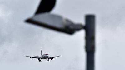 An EasyJet aircraft prepares to land at London Gatwick Airport. AFP