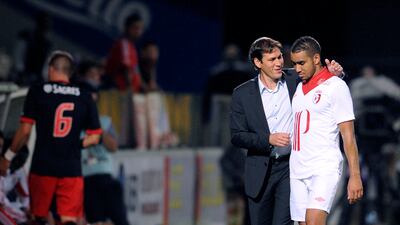 Lille's coach Rudi Garcia speaks with Dimitri Payet during the friendly football match against Benfica at the Saint Symphorien Stadium, on July 16, 2012 in Longeville-Les-Metz. AFP