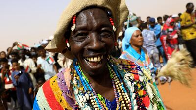 A supporter of Lieutenant General Mohamed Hamdan Dagalo, deputy head of the military council and head of paramilitary Rapid Support Forces (RSF), dances during a meeting in Aprag village, 60km away from Khartoum, Sudan. Reuters