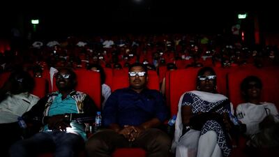 Fans watch Rajinikanth in "2.0" inside a cinema hall. Reuters