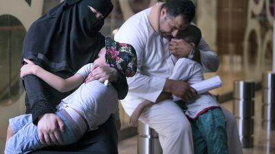 Ab Mahmoud, his wife and two children. The family is asking for donations to help pay for rent and expenses in Deira, Dubai. Leslie Pableo / The National