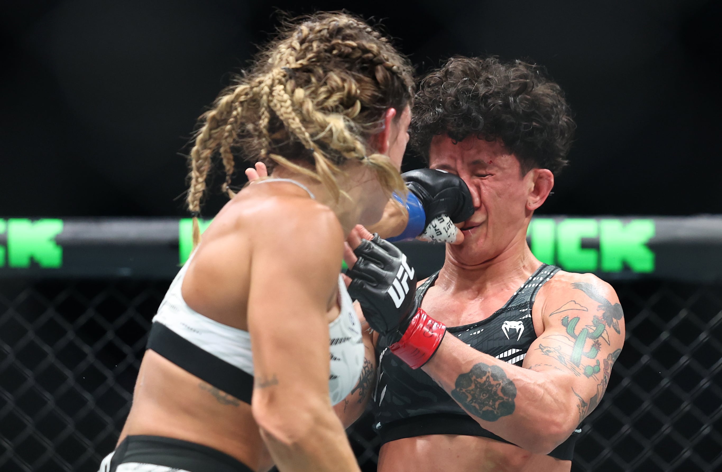 Mackenzie Dern, left, lands a straight left on Virna Jandiroba in the co-main event.