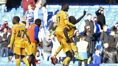 Christian Benteke, second right, celebrates with Mamadou Sakho after scoring Crystal Palace's winning goal in the 2-1 win over Chelsea. Tony O'Brien / Reuters