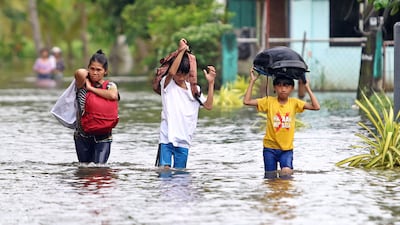 Residents evacuate from their flooded homes on the southern island of Mindanao. AFP