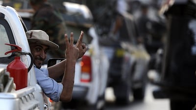 Rebels celebrate in the capital Tripoli following heavy fighting on August 23, 2011, when they overran Libyan leader Moamer Kadhafi's fortified Bab al-Azizya headquarters. AFP PHOTO/FILIPPO MONTEFORTE *** Local Caption *** 666972-01-08.jpg