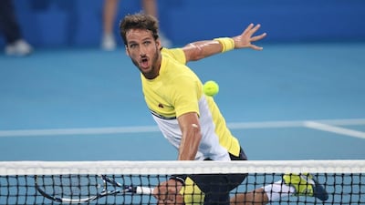 Feliciano Lopez plays a shot at the net during his loss to Andy Murray on Thursday night at the Mubadala World Tennis Championship in Abu Dhabi. Ali Haider / EPA