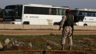 Buses carrying rebels who were evacuated from al-Rastan are seen in Homs countryside, Syria May 7, 2018. Omar Sanadiki / Reuters