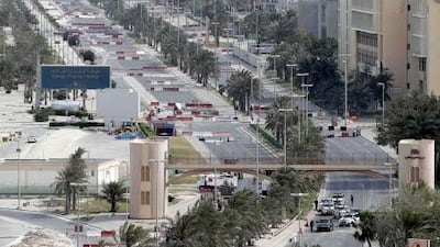 Bahraini troops block streets leading to Pearl Square in the capital Manama. A business exodus has taking place as banks pull out staff. AFP PHOTO/JOSEPH EID