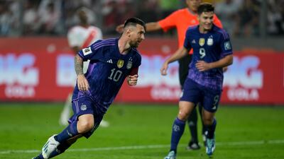 Lionel Messi celebrates scoring Argentina's second goal in the 2-0 win over Peru. AP