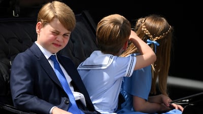 Prince George, Prince Louis and Princess Charlotte ride in a horse-drawn carriage during the Trooping the Colour parade. Reuters