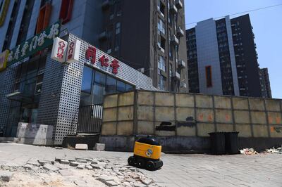 Robot makes its way from a Suning supermarket. AFP