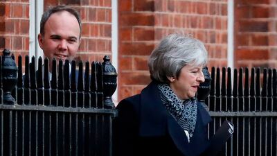 Prime minister Theresa May leaves from the rear of 10 Downing Street as she heads to the Houses of Parliament. AFP