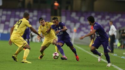 Caio of Al Ain, centre, in action against Al Wasl on Sunday night in the Arabian Gulf League. Photo Courtesy / Aletihad / December 4, 2016