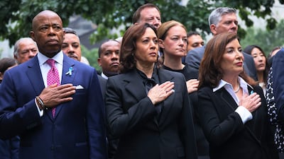 NEW YORK, NEW YORK - SEPTEMBER 11: New York Mayor Eric Adams, Vice President Kamala Harris, and New York Gov. Kathy Hochul place their hands on their heart as the National Anthem is sung during the annual 9/11 Commemoration Ceremony at the National 9/11 Memorial and Museum on September 11, 2023 in New York City. Family and friends honored the lives of their loved ones on the 22nd anniversary of the terror attacks of September 11, 2001, at the World Trade Center, Shanksville, PA and the Pentagon, that killed nearly 3,000 people. Michael M. Santiago/Getty Images/AFP (Photo by Michael M. Santiago / GETTY IMAGES NORTH AMERICA / Getty Images via AFP)