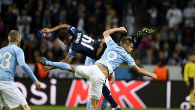 Real Madrid's Casemiro and Malmo's Markus Rosenberg clash during their teams' Champions League match on Wednesday night in Sweden. Anders Wiklund / TT News Agency / Reuters