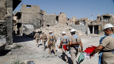 Members of a demining squad take part in an operation to clear mines planted by ISIS militants in the Old City of Mosul, Iraq. All photos: Reuters