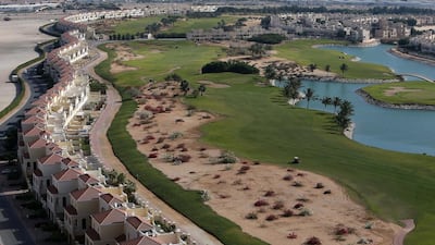 A view of the townhouses and golf course at Al Hamra, Ras Al Khaimah, where rents are much cheaper than Dubai. Pawan Singh / The National
