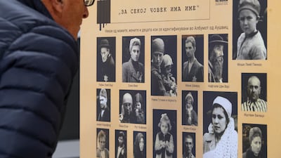 A visitor views an exhibition of documentary photographs from Auschwitz at the Holocaust Museum in Skopje, North Macedonia. EPA