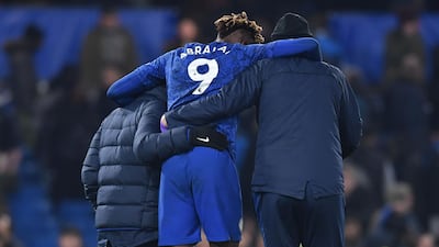 Tammy Abraham is helped off of the pitch at the end of the game against Arsenal at Stamford Bridge. AFP