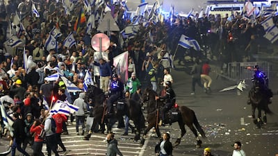 Protesters rampage through the streets in Tel Aviv. AFP