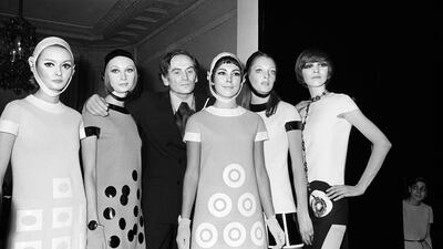 Pierre Cardin flanked by models after his spring /summer show in Paris in January 1967. AFP