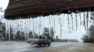 Icicles hang from the "Welcome to Hilliard sign" in Hilliard, Florida. Bob Self / The Florida Times-Union via AP