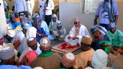 Babagana Umara Zulum, centre, governor of Borno State, prays during a funeral for those killed by suspected Boko Haram militants in Zaabarmar, Nigeria, Sunday, November 29, 2020. AP Photo
