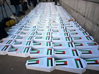 White cardboard coffins bearing the names of children killed in Gaza were place in the street opposite the Prime Minister’s residence. Lemma Shehadi / The National
