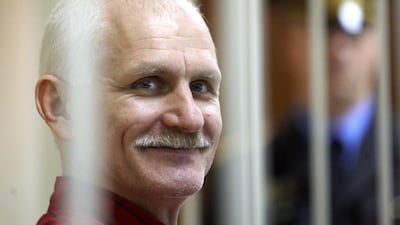 Belarusian human rights activist Ales Bialiatski sits inside a cell during a court session in Minsk, Belarus. EPA.