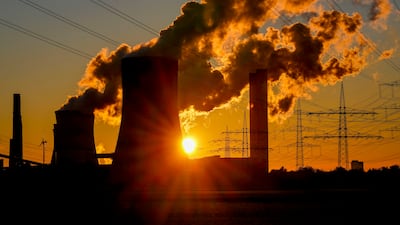 Steam comes out of the chimneys of the coal-fired power station in Niederaussem, Germany. The share of coal around the world has fallen to an all-time low. AP Photo