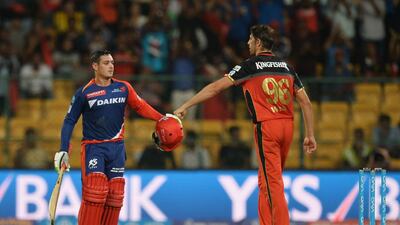 Royal Challengers Bangalore bowler David Wiese, right, greets Delhi Daredevils batsman Quinton de Kock. Manjunath Kiran / AFP