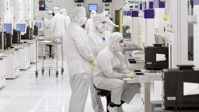 Engineers working in one of the clean rooms at GlobalFoundries' facility in Dresden Germany. Jeff Topping / The National
