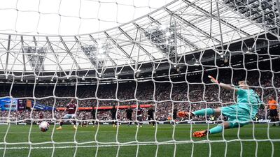 West Ham United's Said Benrahma scores their first goal from the penalty spot to make it 2-1 to Arsenal. Reuters