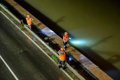 National disaster management rescue staff search for survivors on the River Danube. MTI via AP